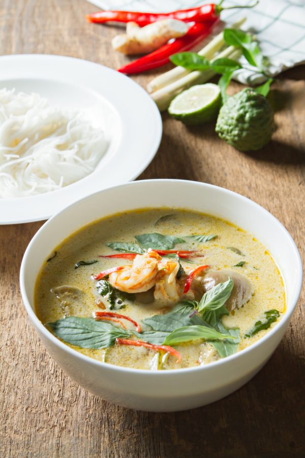 Green curry with shrimp and rice noodles. Thai cuisine.