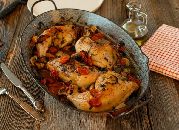 Braised chicken legs with tomatoes, basil, garlic and olive oil