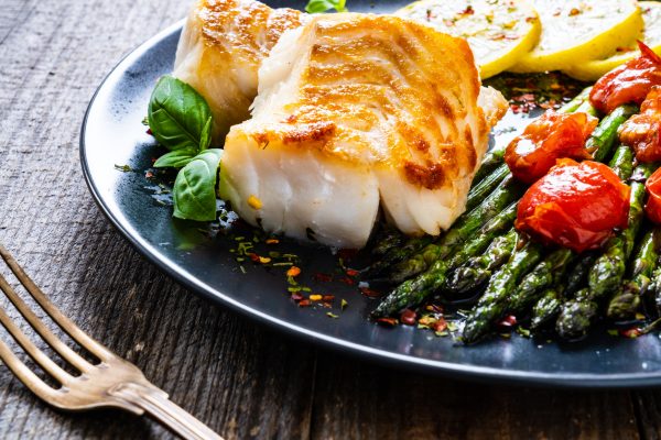 Fried cod fillet with fresh vegetables