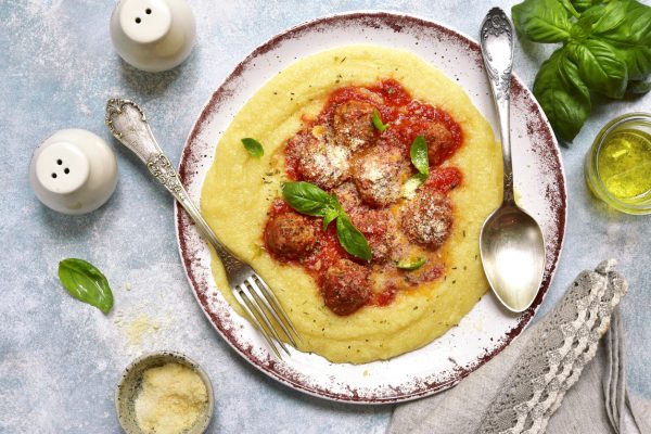 Polenta with meatballs in tomato sauce
